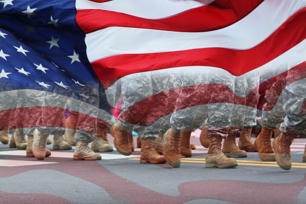 American Flag and troops marching